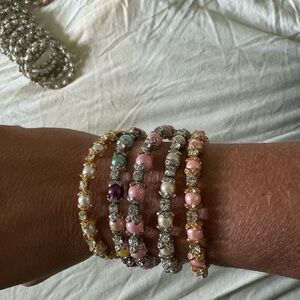 172 baby and kids Pearl and rhinestone bangles in a big lot.